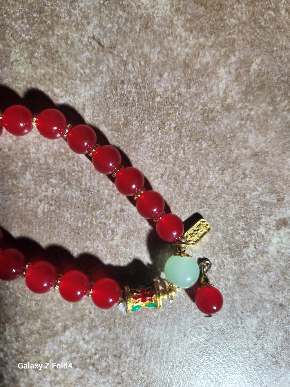 Women’s Red Beaded Bracelet with Gold Accents and Mint Charm